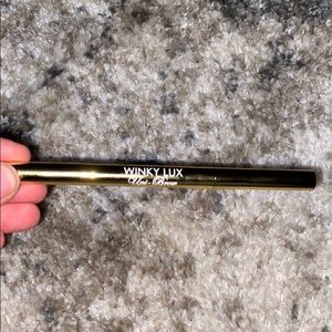 Winky Lux uni-brow